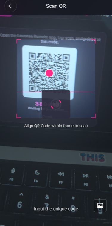 The Lovense app's scanner, pointed at the QR code on a laptop screen.